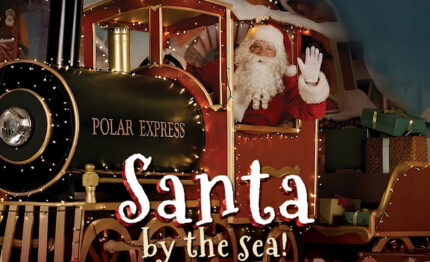 Santa on festive train at magical Sligo Christmas event, surrounded by gifts and holiday decor, inviting atmosphere.