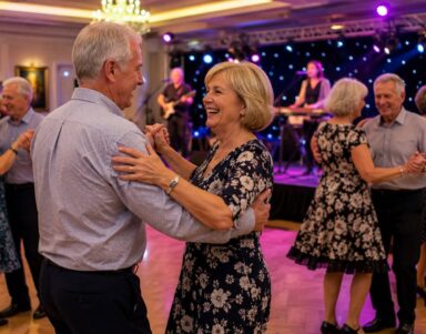 Guests enjoying an elegant ballroom dance with live band and ambient lighting at the luxurious hotel event space.