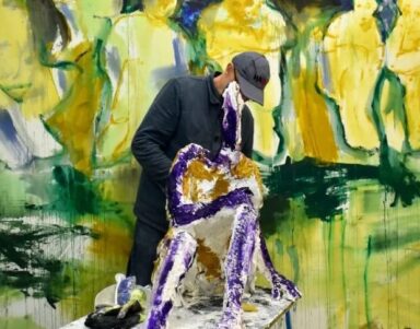 Vibrant art installation with a sculptor shaping a colourful, abstract figure, reflecting the hotel's creative atmosphere.