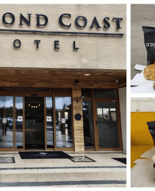 Entrance of Diamond Coast Hotel with welcome snacks, showcasing a warm atmosphere and gourmet treats.